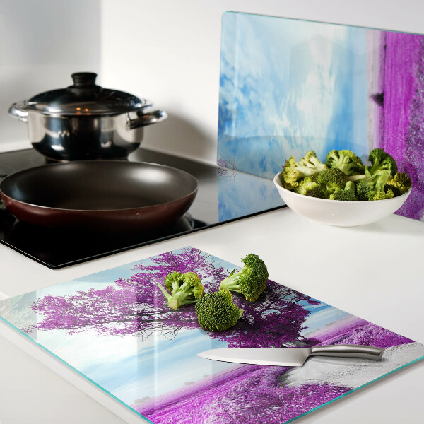 Tagliere in vetro temperato con motivo di un albero viola su sfondo di cielo