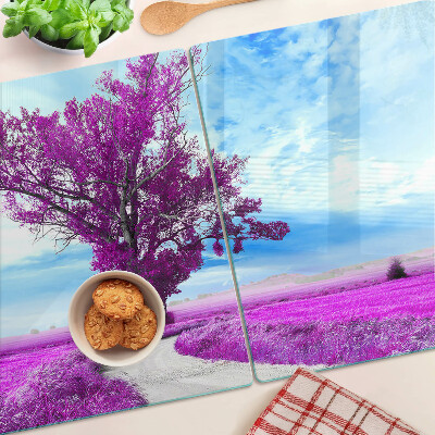 Tagliere in vetro temperato con motivo di un albero viola su sfondo di cielo