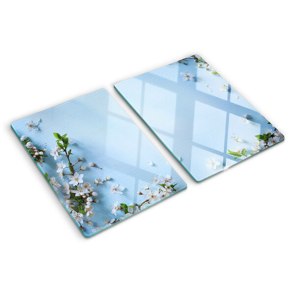 Tagliere in vetro con motivo floreale su fondo blu