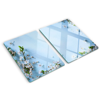 Tagliere in vetro con motivo floreale su fondo blu