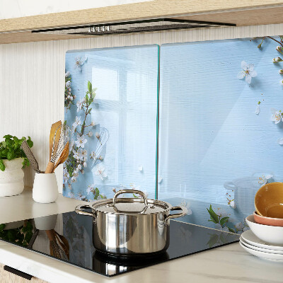 Tagliere in vetro con motivo floreale su fondo blu