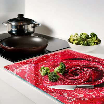 Tagliere in vetro temperato con motivo di rosa rossa e gocce d'acqua