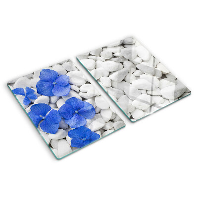 Tagliere in vetro temperato con motivo di fiori blu su sfondo di pietre bianche