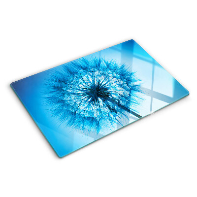 Tagliere in vetro con motivo di dente di leone su sfondo blu