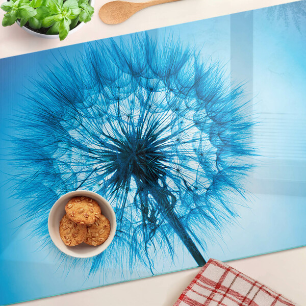 Tagliere in vetro con motivo di dente di leone su sfondo blu