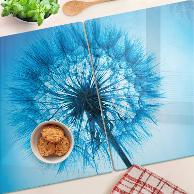 Tagliere in vetro con motivo di dente di leone su sfondo blu