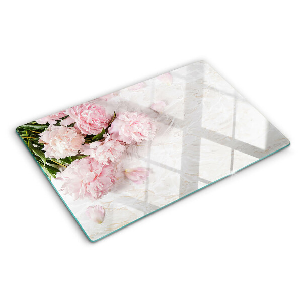 Tagliere in vetro temperato con decorazione di fiori di peonia su sfondo marmo