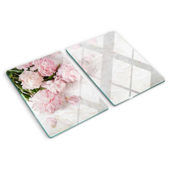 Tagliere in vetro temperato con decorazione di fiori di peonia su sfondo marmo