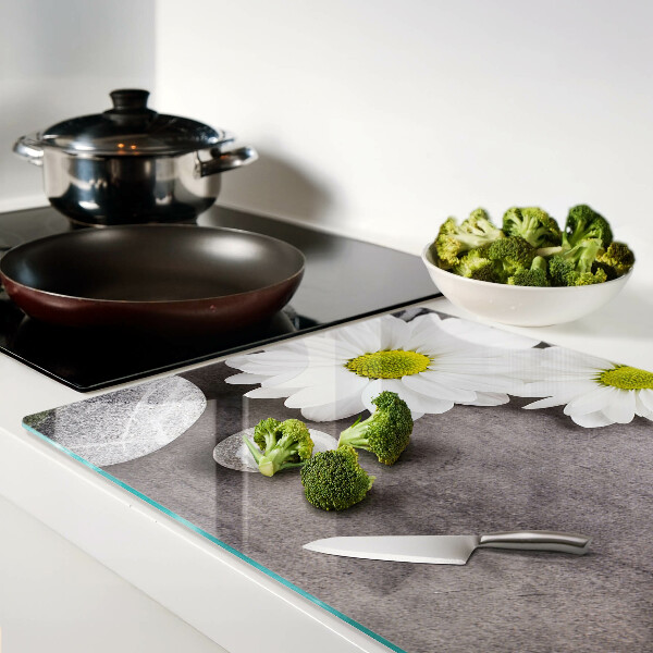 Tagliere in vetro temperato Fiori e pietre sullo sfondo