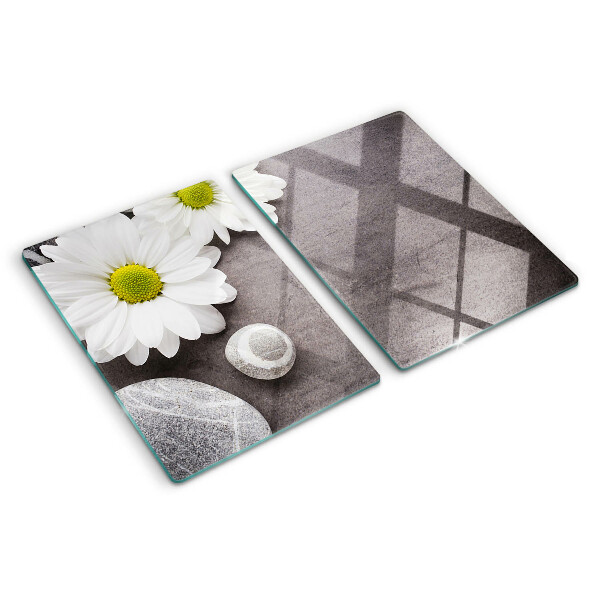 Tagliere in vetro temperato con decorazione a fiori e motivi pietrosi sullo sfondo