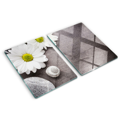 Tagliere in vetro temperato con decorazione a fiori e motivi pietrosi sullo sfondo