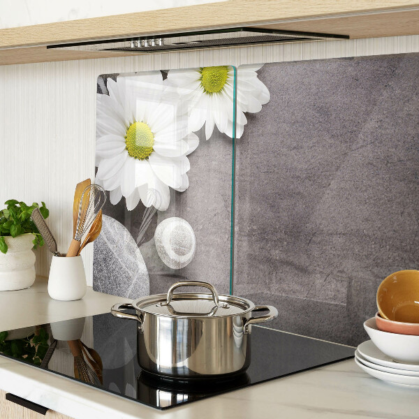 Tagliere in vetro temperato con decorazione a fiori e motivi pietrosi sullo sfondo