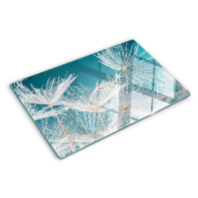 Tagliere in vetro temperato con motivo di denti di leone su sfondo blu