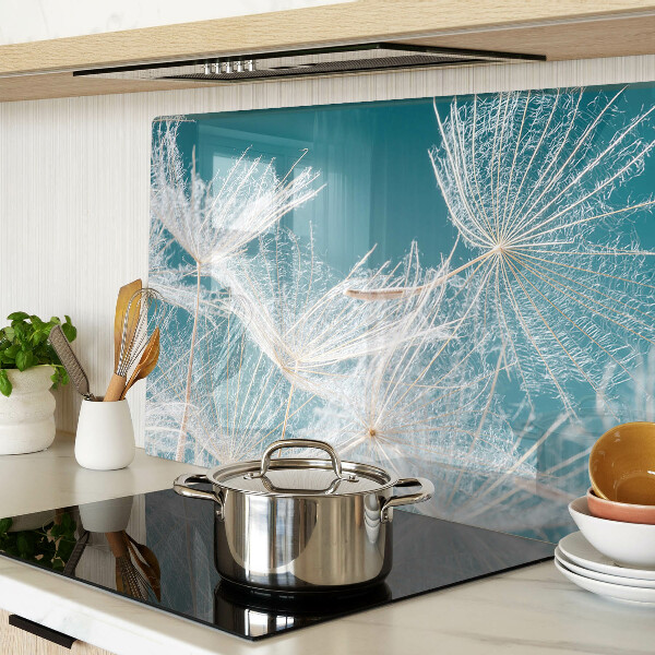 Tagliere in vetro temperato con motivo di denti di leone su sfondo blu