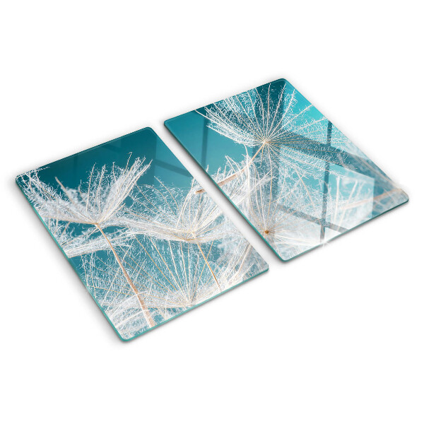 Tagliere in vetro temperato con motivo di denti di leone su sfondo blu