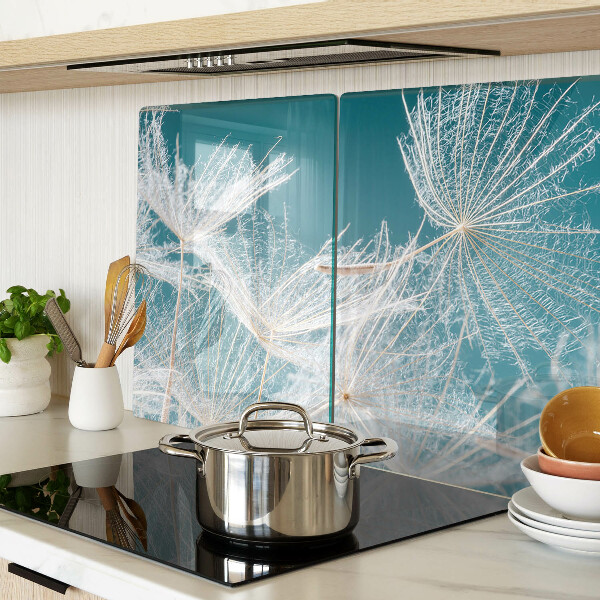 Tagliere in vetro temperato con motivo di denti di leone su sfondo blu