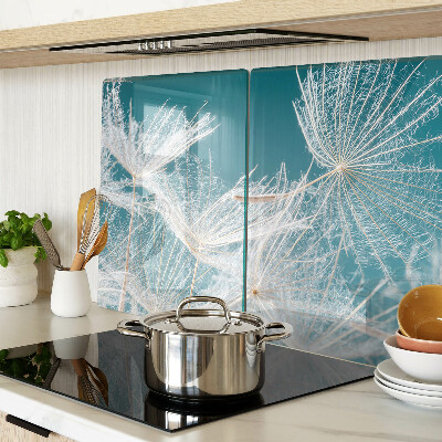 Tagliere in vetro temperato con motivo di denti di leone su sfondo blu