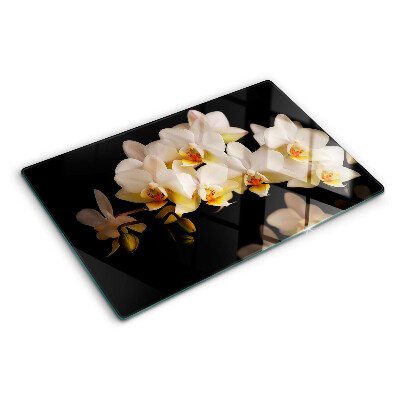 Tagliere in vetro con stampa di orchidee su sfondo nero