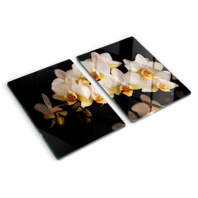 Tagliere in vetro con stampa di orchidee su sfondo nero