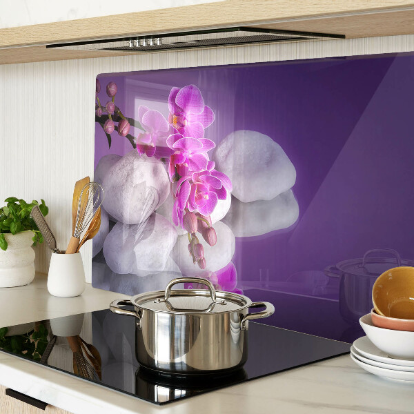 Tagliere in vetro temperato con motivo di fiori di orchidea su sfondo pietre