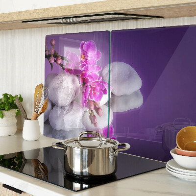 Tagliere in vetro temperato con motivo di fiori di orchidea su sfondo pietre