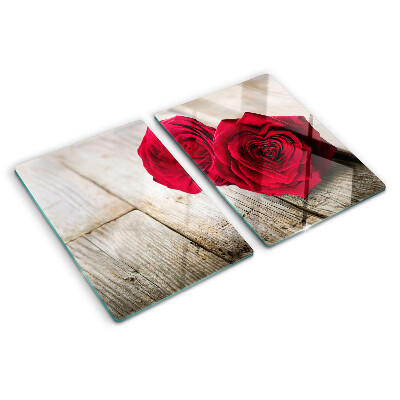 Tagliere in vetro con stampa di rose rosse su sfondo di legno