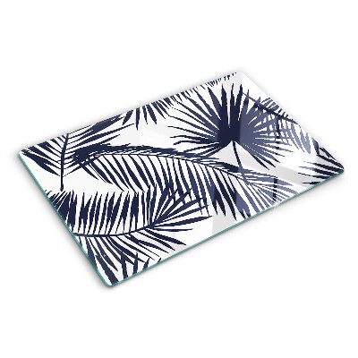 Tagliere in vetro con stampa di foglie di palma su sfondo bianco