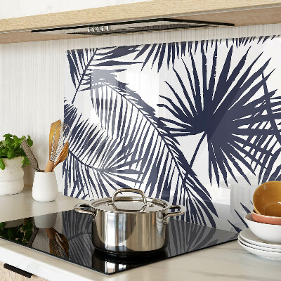 Tagliere in vetro con stampa di foglie di palma su sfondo bianco