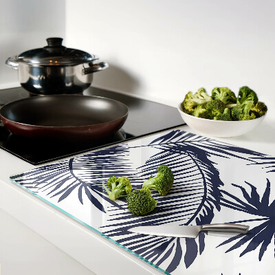 Tagliere in vetro con stampa di foglie di palma su sfondo bianco