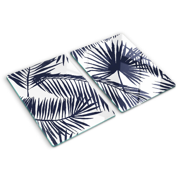 Tagliere in vetro con stampa di foglie di palma su sfondo bianco