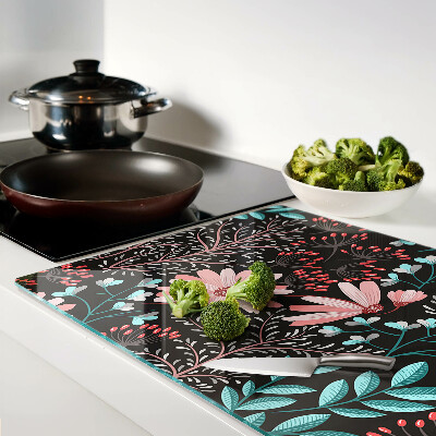 Tagliere in vetro temperato con motivo floreale su sfondo scuro