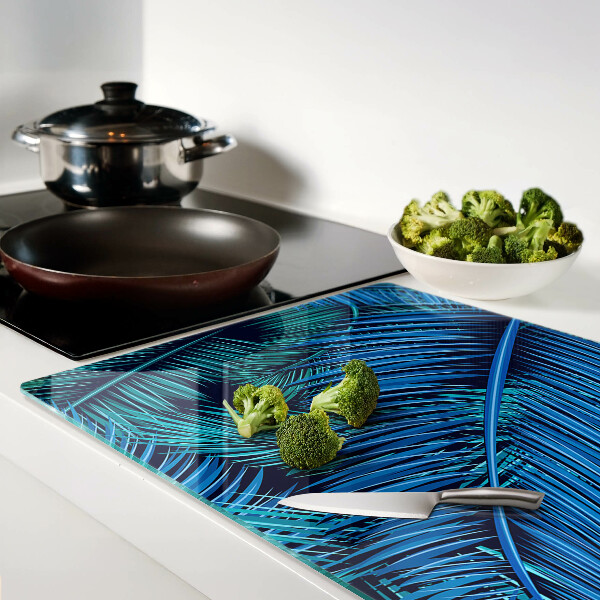 Tagliere in vetro temperato con decorazione a foglie di palma nei toni del blu