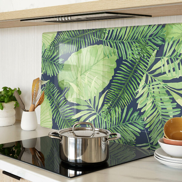 Tagliere in vetro temperato con motivo di foglie tropicali su sfondo scuro