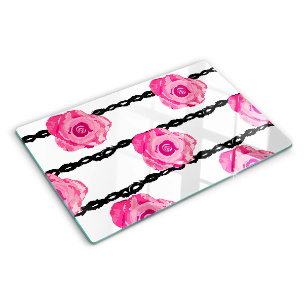 Tagliere in vetro con motivo di rose su sfondo con linee nere