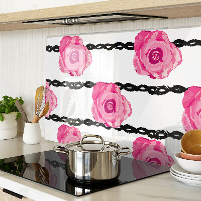 Tagliere in vetro con motivo di rose su sfondo con linee nere