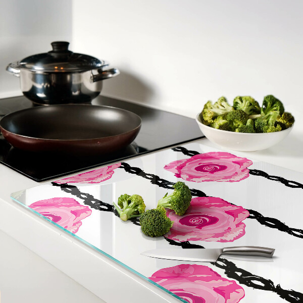 Tagliere in vetro con motivo di rose su sfondo con linee nere