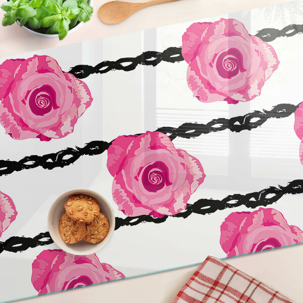 Tagliere in vetro con motivo di rose su sfondo con linee nere