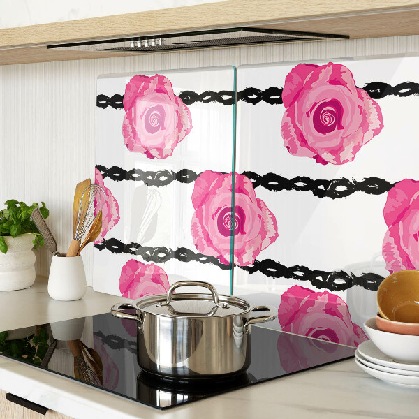 Tagliere in vetro con motivo di rose su sfondo con linee nere