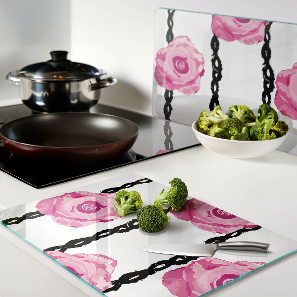 Tagliere in vetro con motivo di rose su sfondo con linee nere