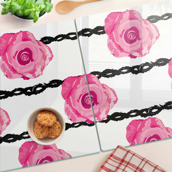 Tagliere in vetro con motivo di rose su sfondo con linee nere