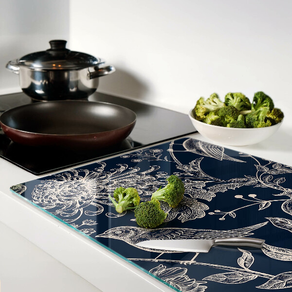 Tagliere in vetro temperato con motivo di fiori e uccelli su sfondo scuro