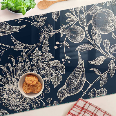 Tagliere in vetro temperato con motivo di fiori e uccelli su sfondo scuro