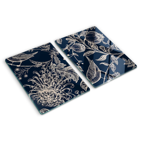 Tagliere in vetro temperato con motivo di fiori e uccelli su sfondo scuro