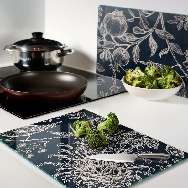 Tagliere in vetro temperato con motivo di fiori e uccelli su sfondo scuro