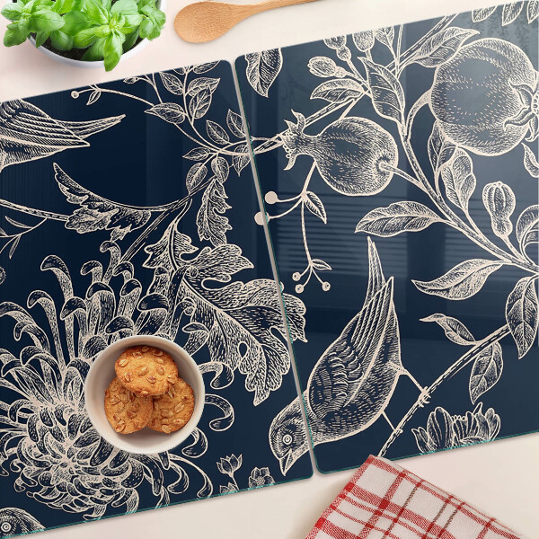 Tagliere in vetro temperato con motivo di fiori e uccelli su sfondo scuro