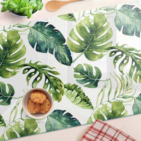 Tagliere in vetro temperato con motivo di foglie di monstera nei toni del verde