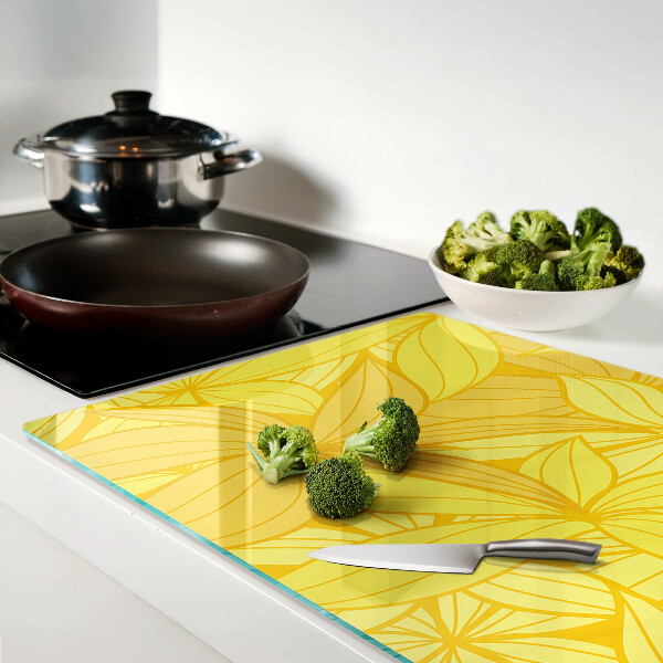 Tagliere in vetro temperato con motivo di foglie gialle in stile tropicale