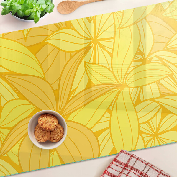 Tagliere in vetro temperato con motivo di foglie gialle in stile tropicale