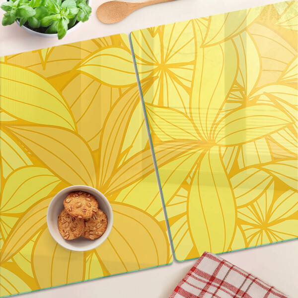 Tagliere in vetro temperato con motivo di foglie gialle in stile tropicale