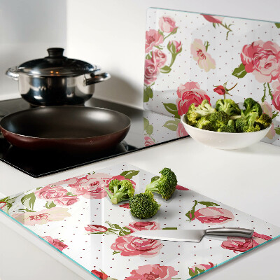 Tagliere in vetro con motivo di rose su sfondo bianco